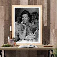 Load image into Gallery viewer, Dorothea Lange&#39;s Migrant Mother Framed Hanging Above A Table
